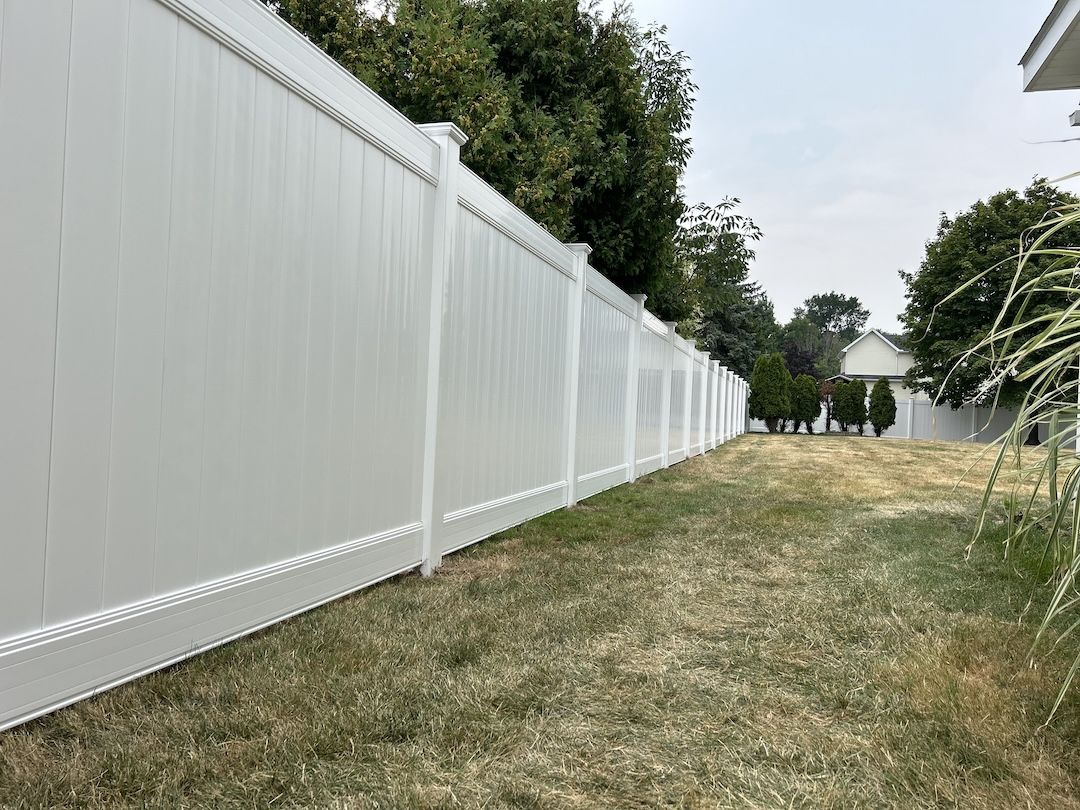 Vinyl privacy fence installed along a yard in Baton Rouge, LA